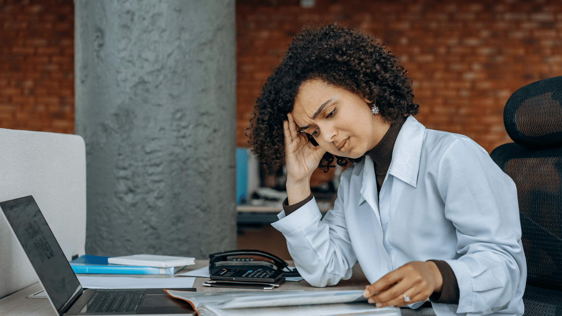 Dealer manually confirming insurance at her desk